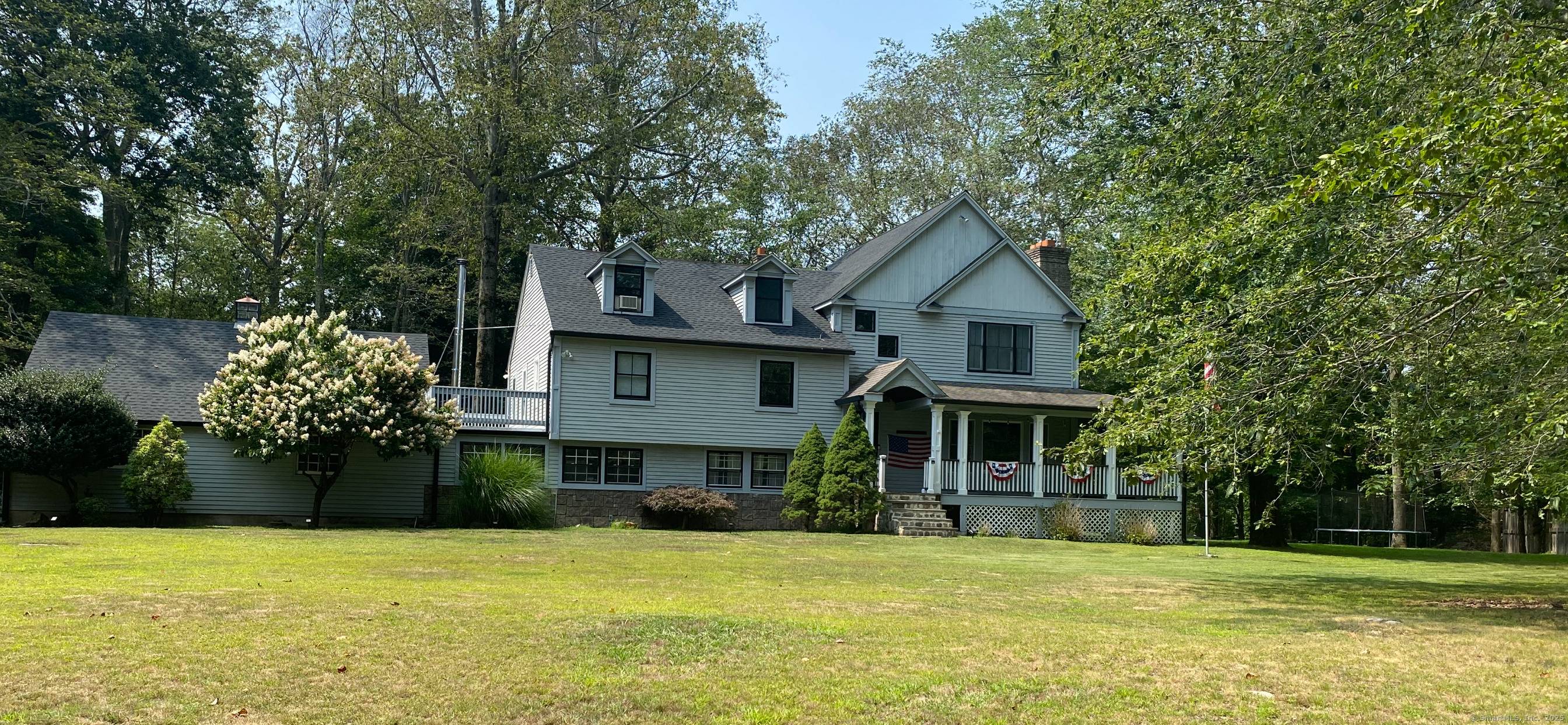 Nestled on a level one acre lot within a coveted cul de sac and surrounded by higher end homes, this beautifully updated residence offers five spacious bedrooms and four well ...