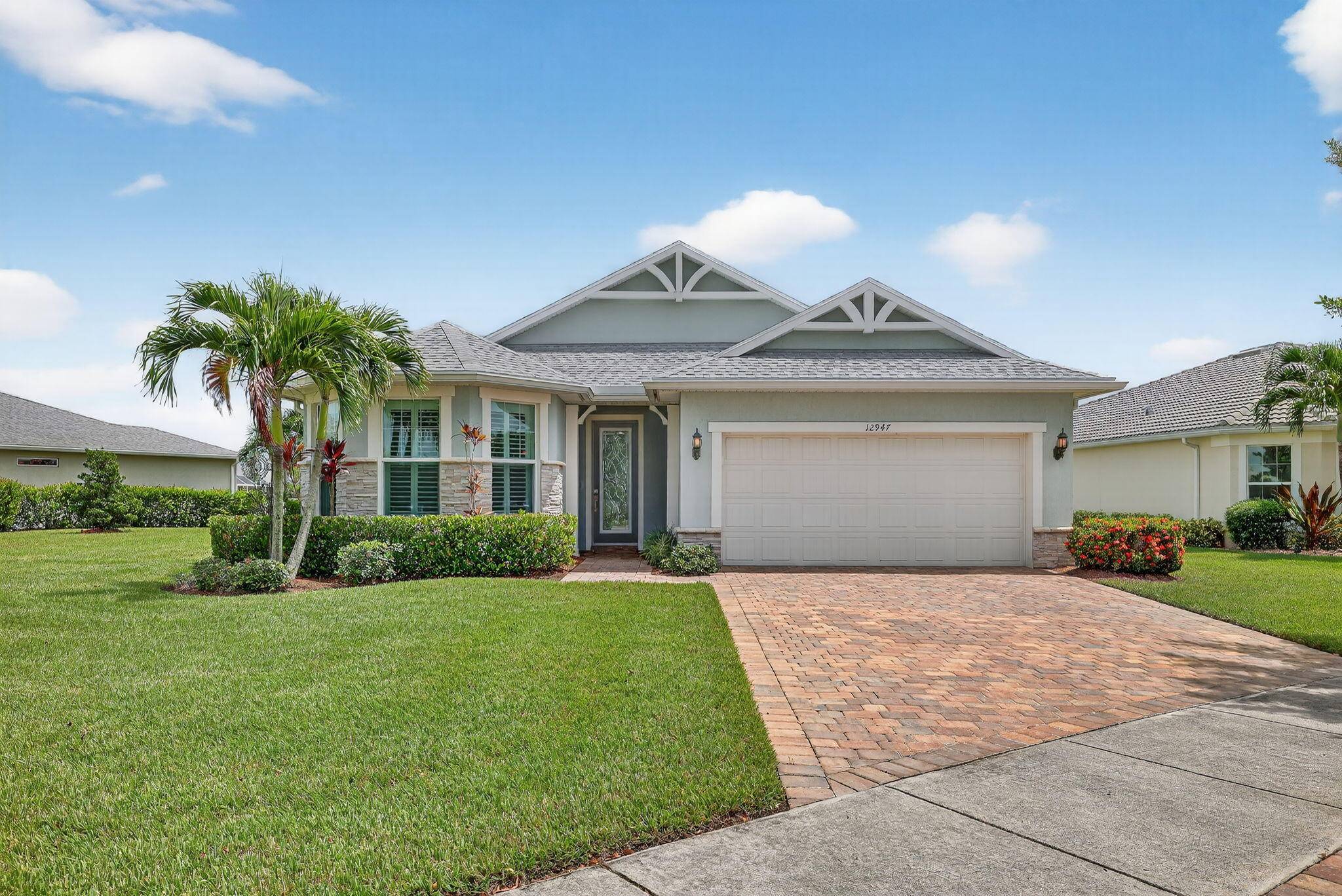 Come see this stunning waterfront home on an oversized corner lot in the highly sought after Del Webb Tradition 55 community !