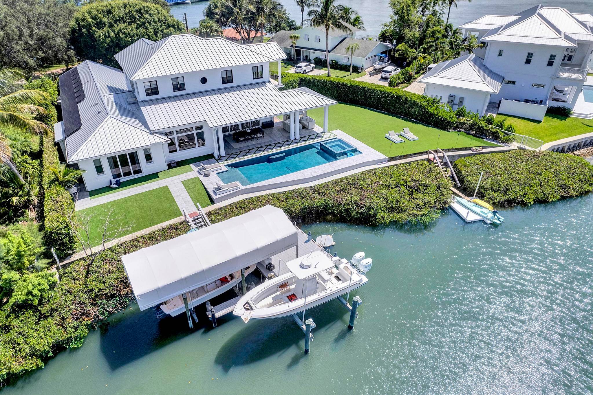 Just 5 minutes from the Jupiter Inlet, this stunning 2017 built Riverfront Home on a half acre lot on the Loxahatchee River offers an unparalleled waterfront lifestyle.