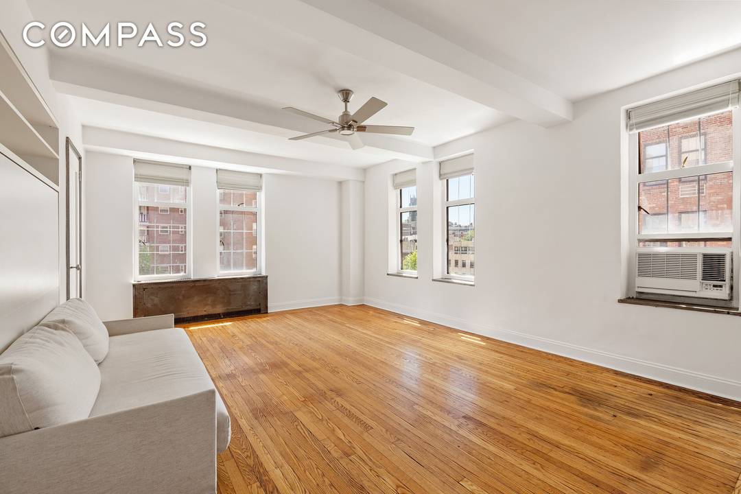 Residence 6B is a bright and spacious corner studio with excellent Southern and Eastern light through seven oversized windows.