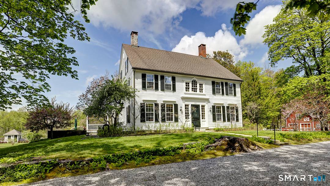 Corner house is a magnificent 1790 Center Hall Colonial with its 2 car detached garage barn and beautifully landscaped saltwater pool on a total of 15.
