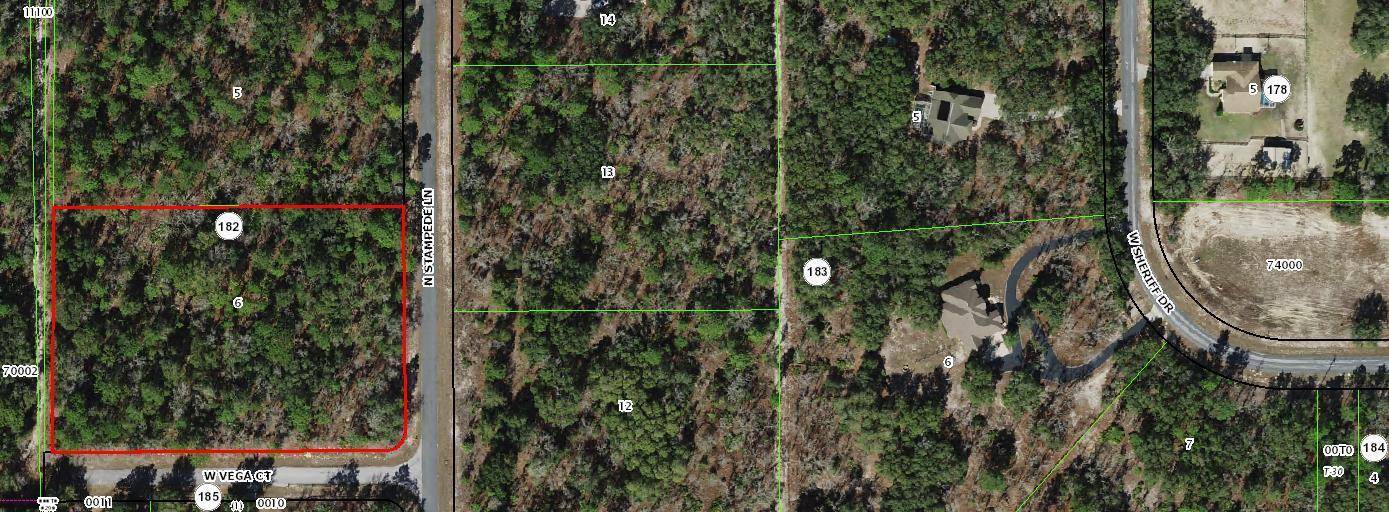 2. 97 acre corner homesite in popular Pine Ridge.