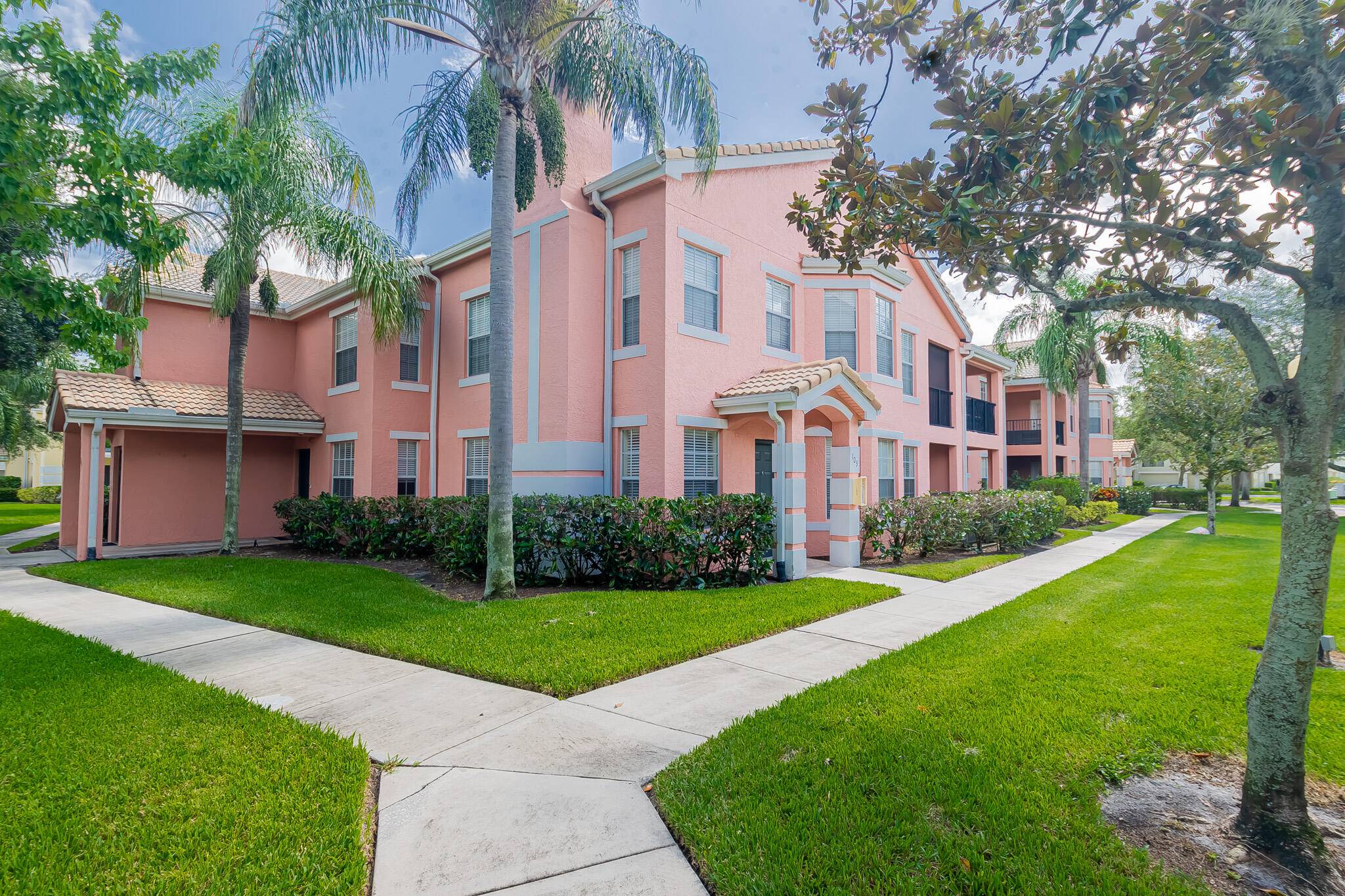 Rarely available ground floor, corner unit in The Belmont a gated community in St.