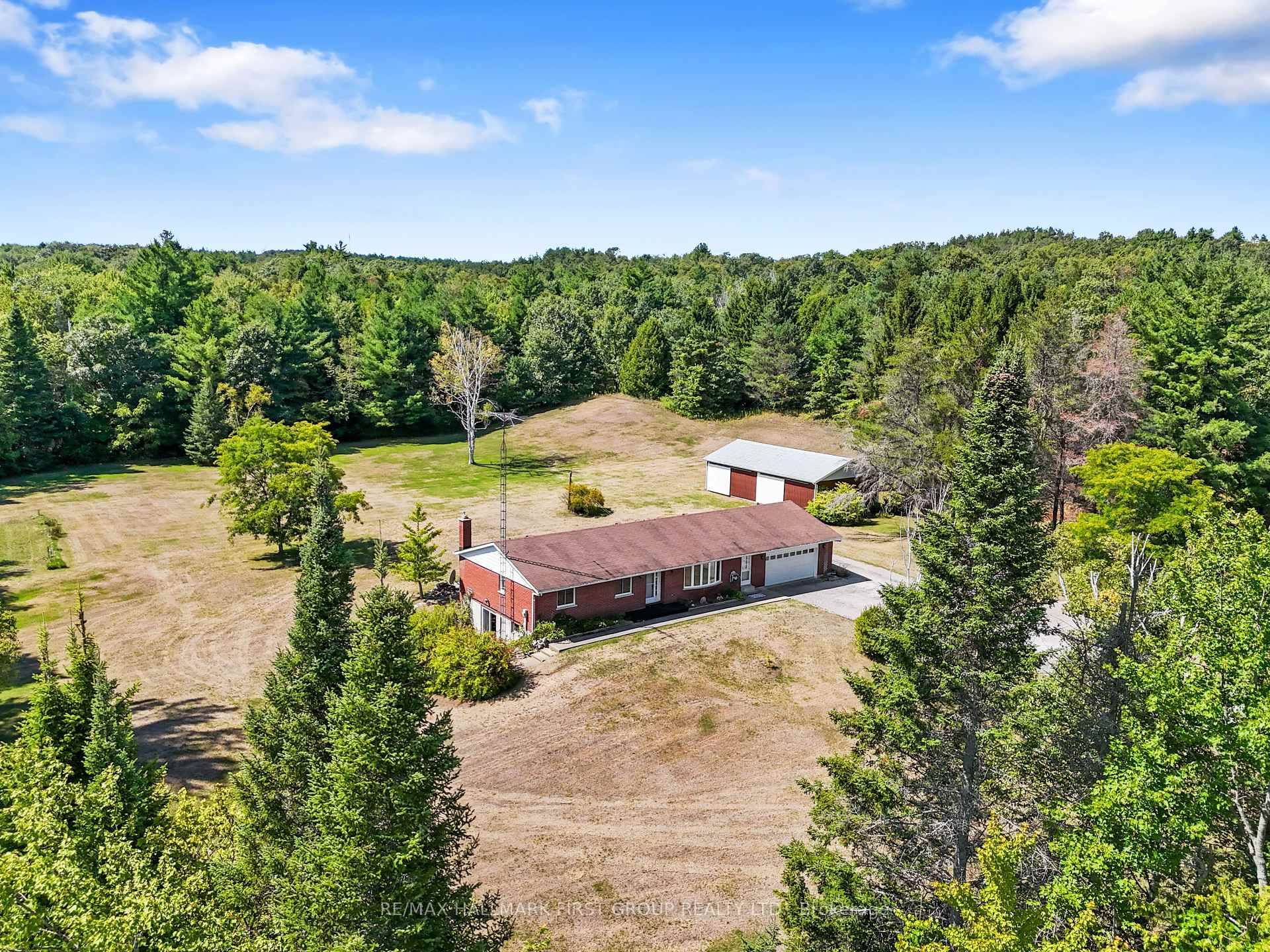 Situated on 4. 63 acres on a quiet, dead end street, this character filled bungalow offers an attached garage, a detached workshop, and a walkout basement with potential for in ...