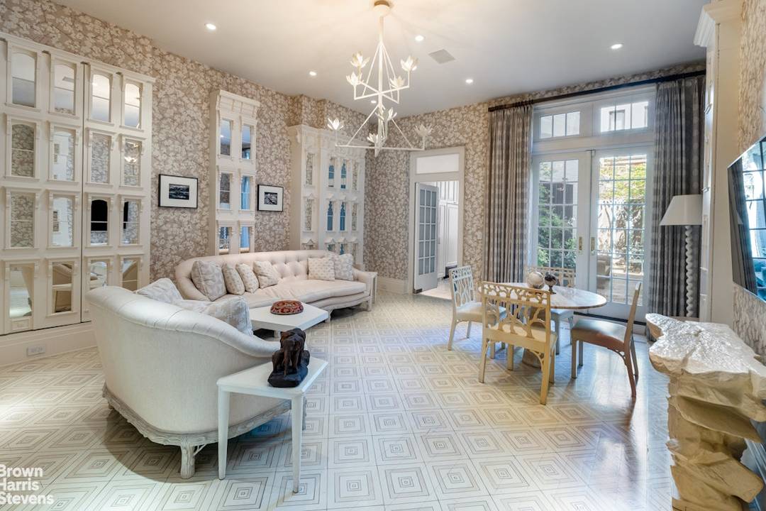 A Magnificent Townhouse of Timeless Elegance Both grand in scale and warmly inviting, this exceptional home just off Park Avenue offers over 8, 100 interior square feet of refined living.