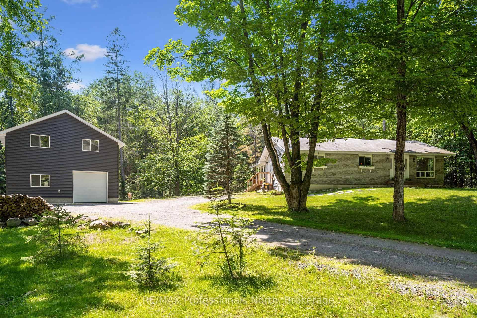 Embrace vibrant country living just 10 minutes from Huntsville with this breathtaking 2 acre forested property perfect blend of rustic charm and entrepreneurial potential.