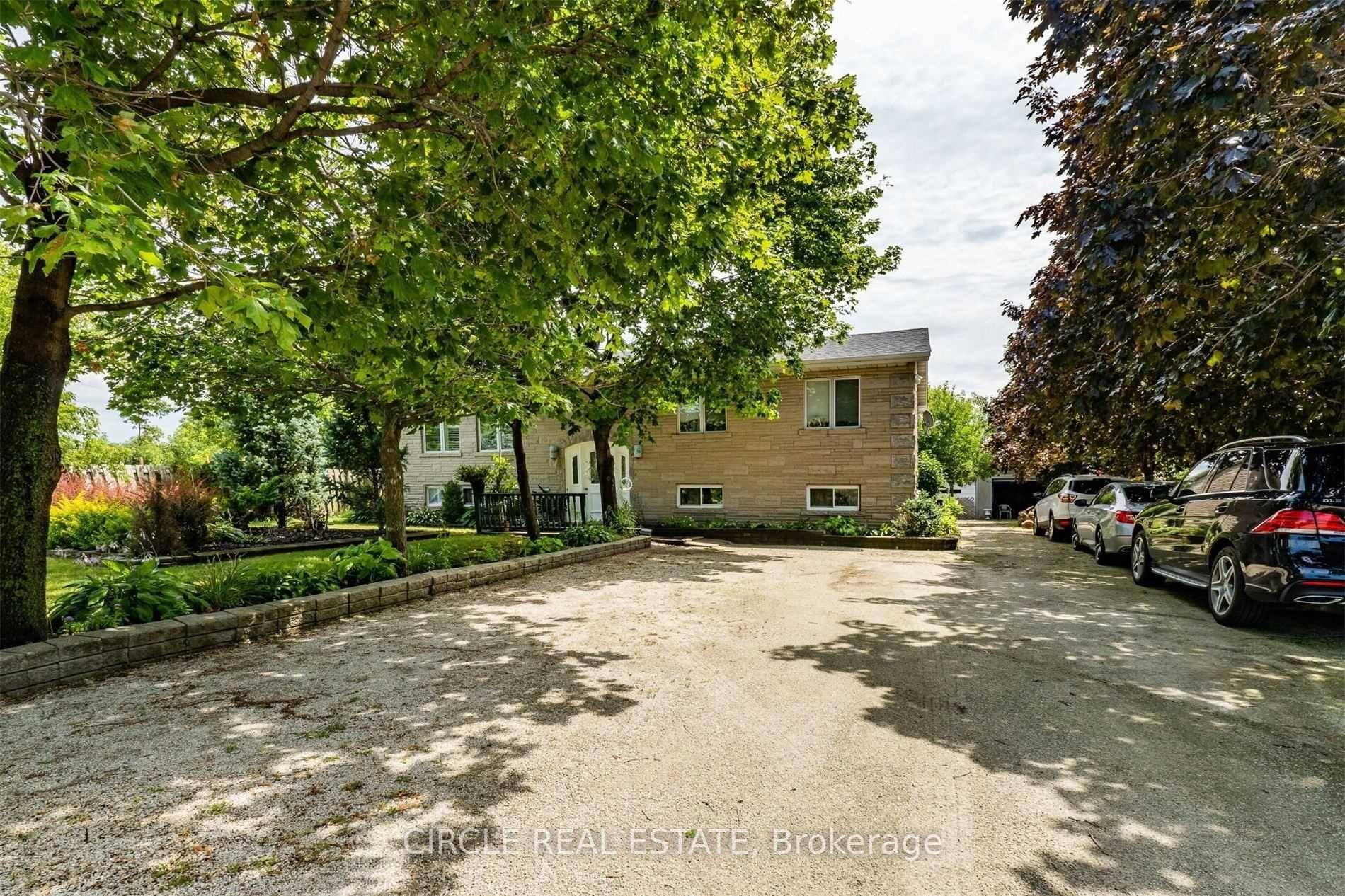 Highway Commercial Zoned, 3 Bedrooms Custom Built Bungalow, Fully Stoned Stucco Exterior, Fully Fenced amp ; A Remote Controlled Gate To The Lot.