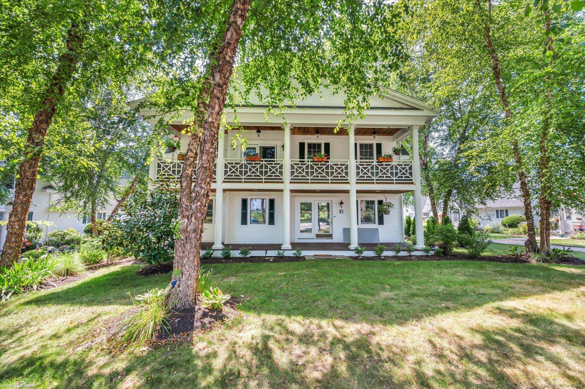 Where architectural design evolves showcasing the expansive high style Georgian Colonial dressed in oversized columned duel front porches proudly displaying traditional charm visual comfort.