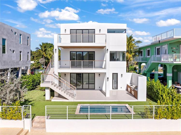 Brand new contemporary waterfront home in premier Plantation Key with 60 ft of protected deep water dockage and seawall, offering direct canal access to Tavernier Creek, the Atlantic Ocean, and ...