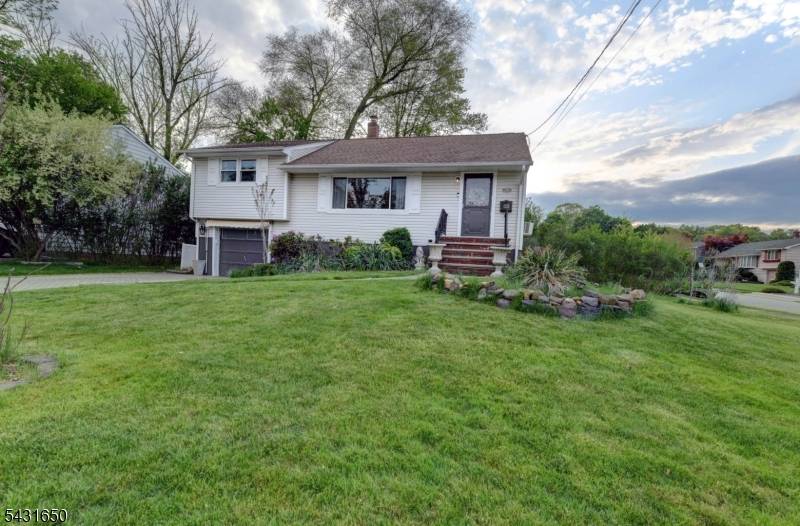 Nicely maintained mid century back split on a prime corner lot in the heart of Cedar Grove's recreation corridor.