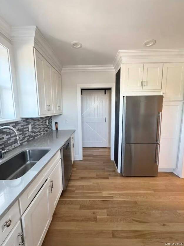 Beautifully renovated three bedroom residence in the heart of downtown Mamaroneck !