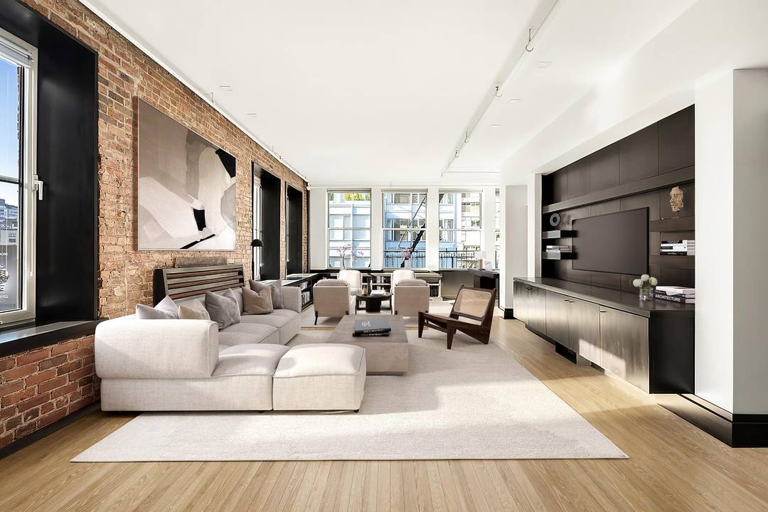 Light and Views ! Exceptionally rare broad southern exposure offers light and epic iconic skyline views, which set this gut renovated floor through three bedroom historic SoHo loft apart from ...