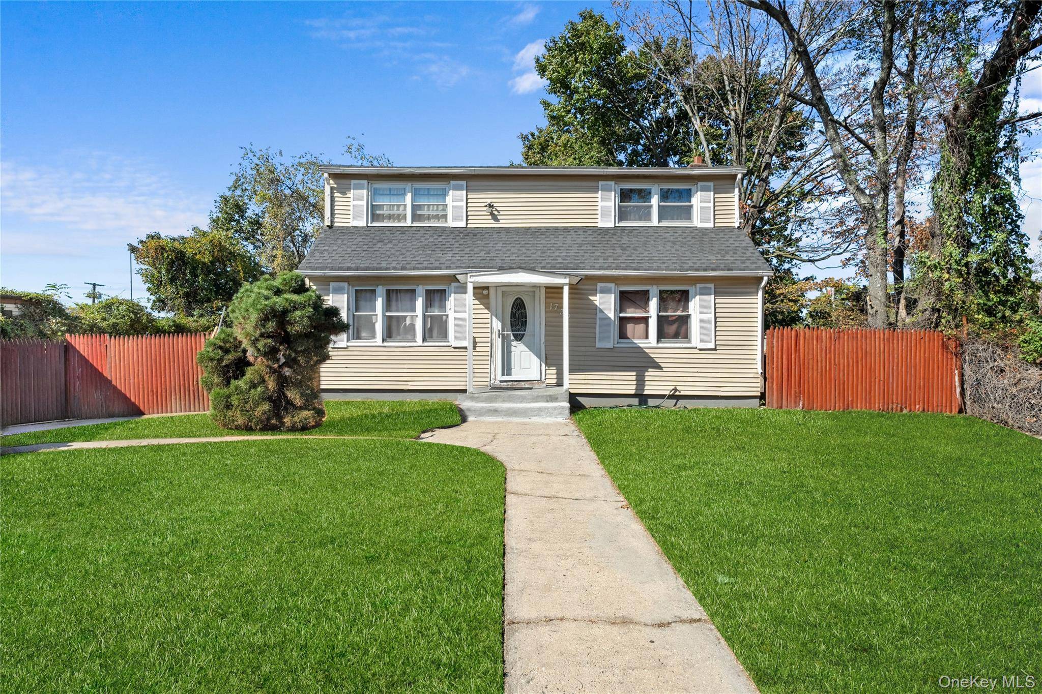 Spacious 5 bed, 2 bath home on an oversized lot in Bay Shore with a full basement and tons of potential !