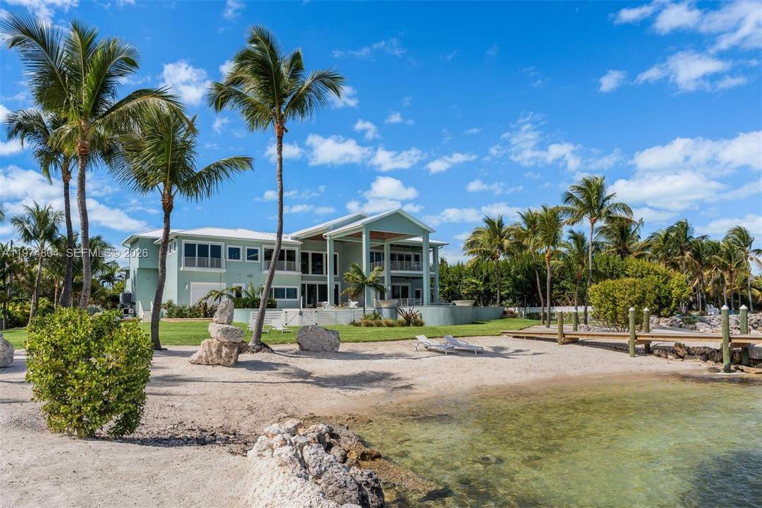 Newly completed in 2025, this exceptional oceanfront estate is located in the heart of The Florida Keys on the premier ocean side of Islamorada.