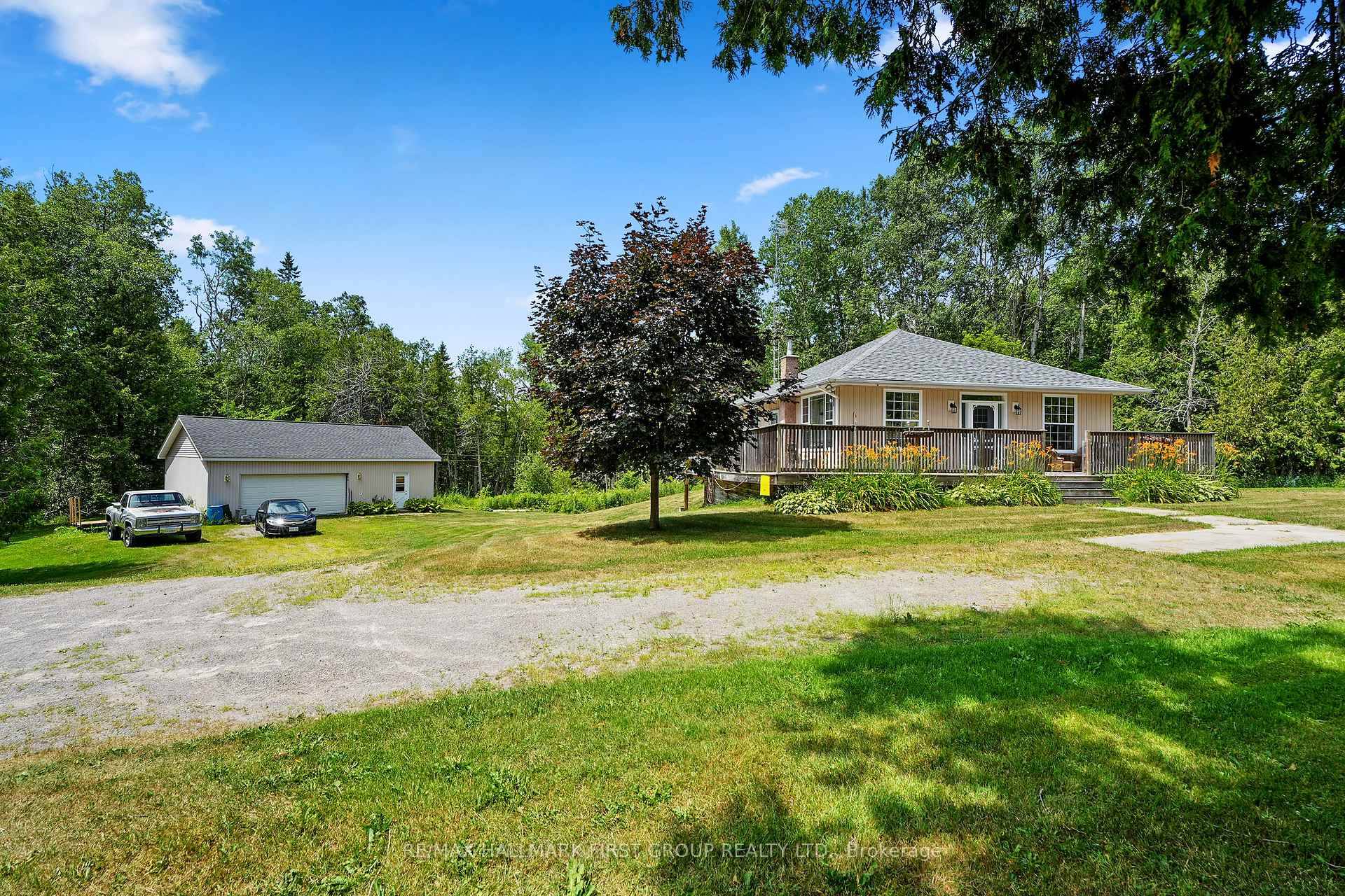 This charming bungalow sits on over an acre, just minutes from Rice Lake, and offers more than meets the eye.