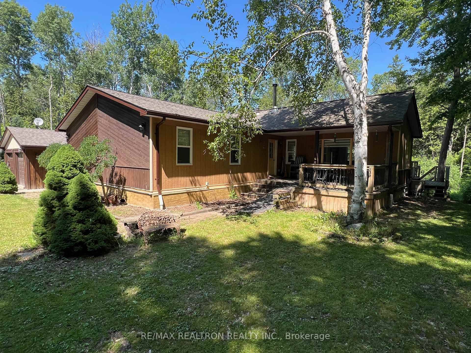 Beautifully updated and spacious 3 bedroom bungalow on serene and very private 1.