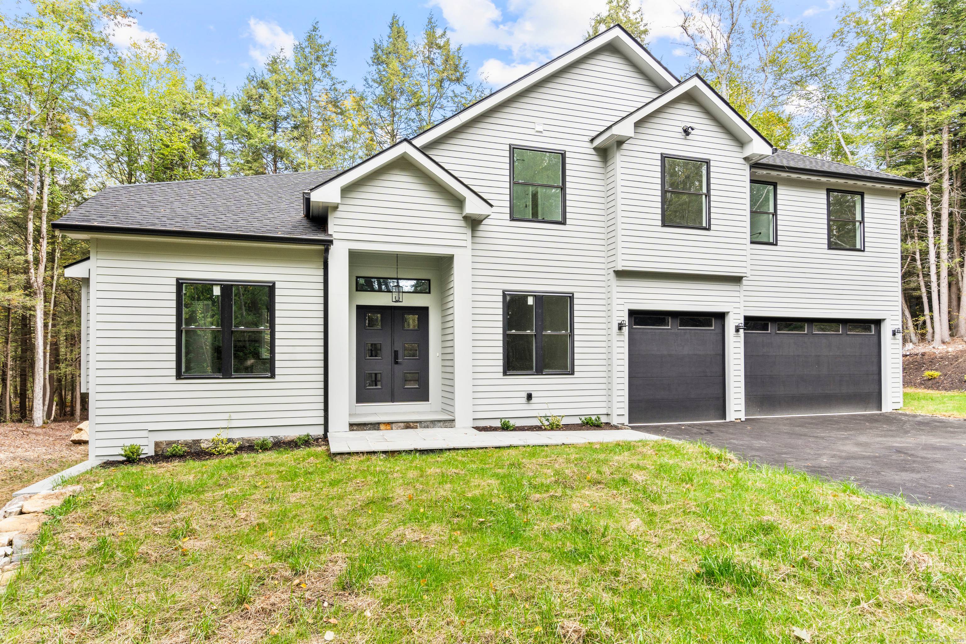Welcome to 68 Paxton Court, a stunning new construction completed in 2025 and tucked on a quiet cul de sac in the Woodridge Lake community.