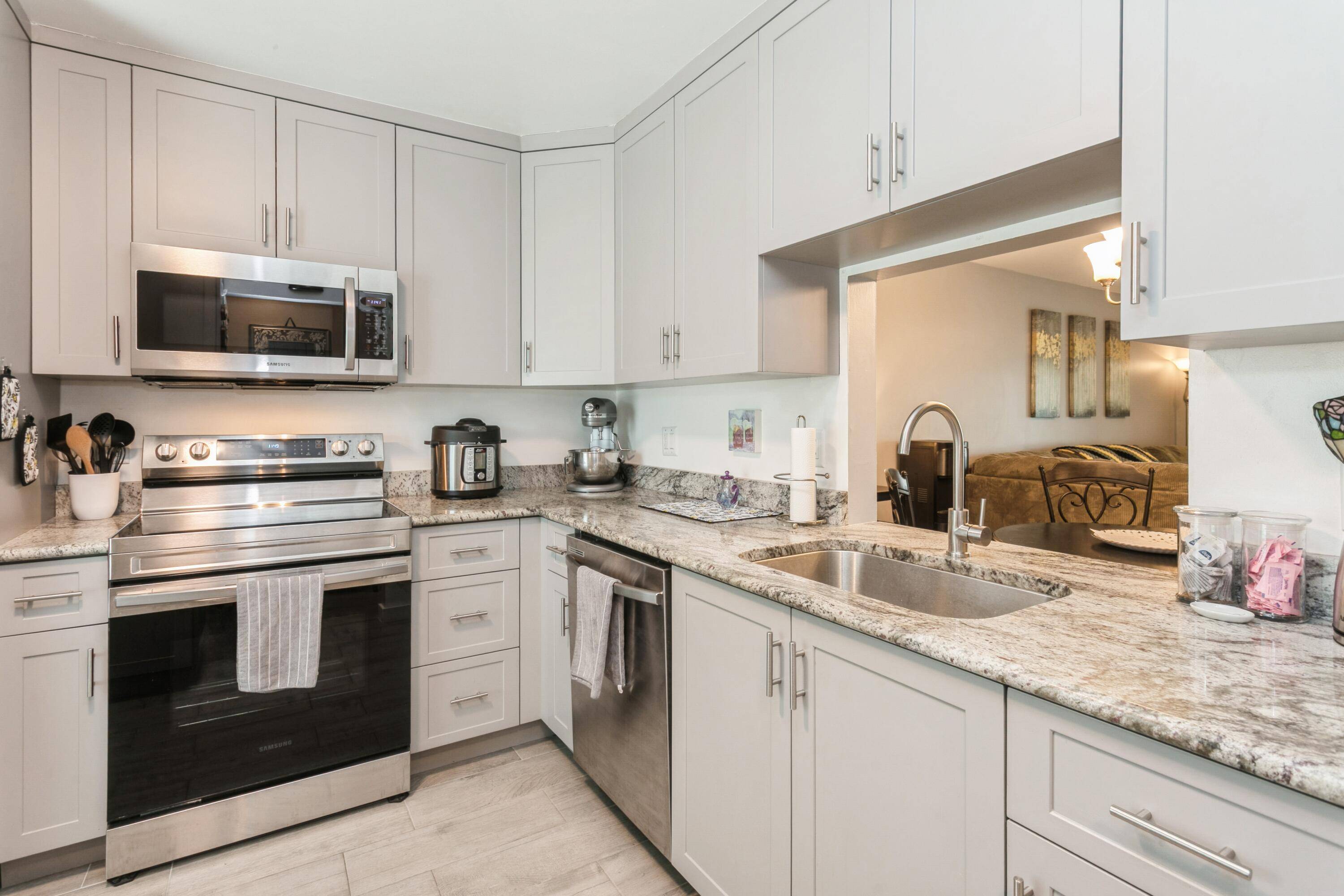 Completely Renovated ! This stunning 2 bedroom, 2 bathroom corner unit features an updated kitchen with granite countertops, custom cabinetry, and brand new stainless steel appliances.