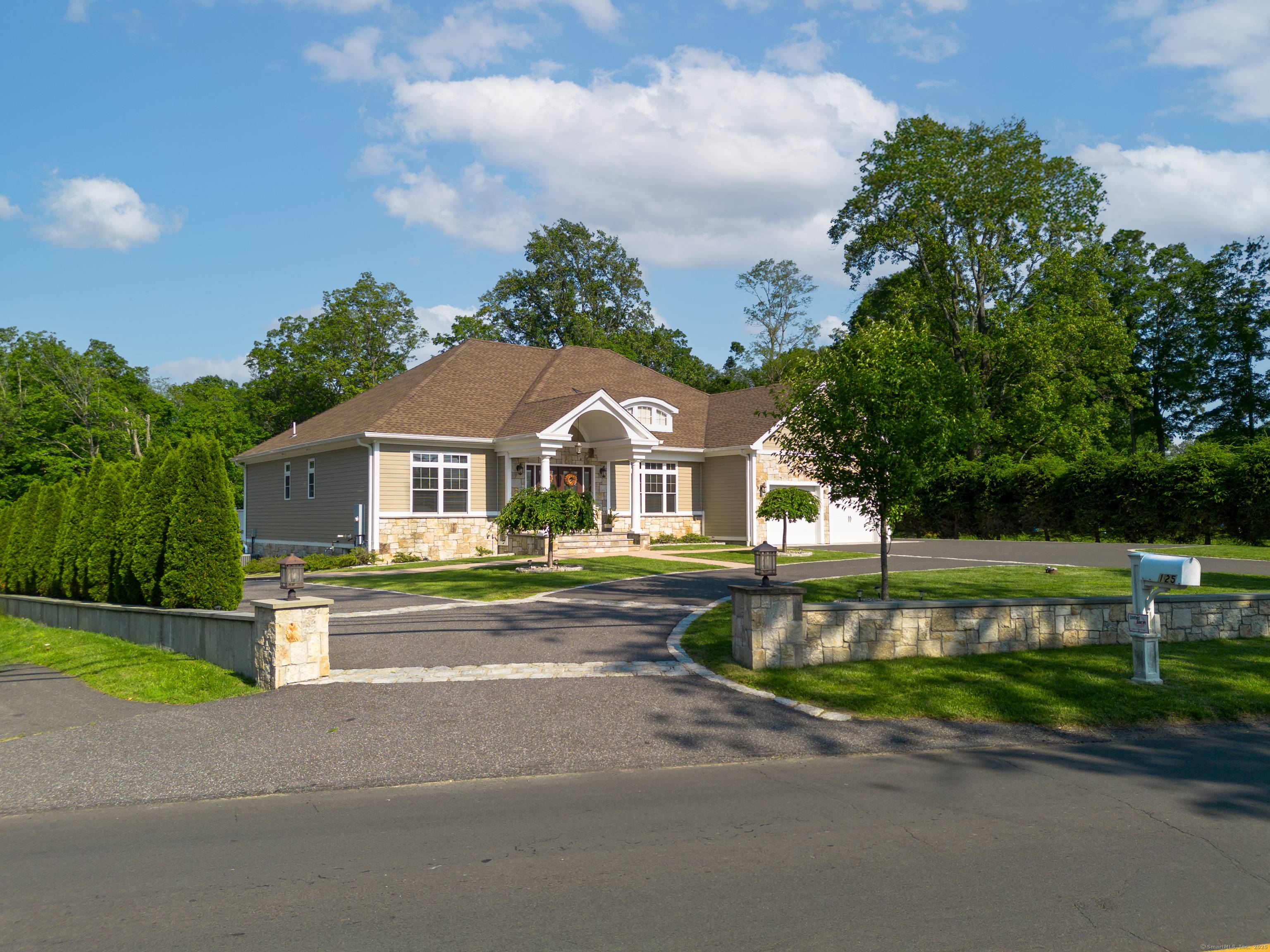 Live the luxury you deserve in this majestic double level Ranch embraced by circular drive and estate stone walls on 2.