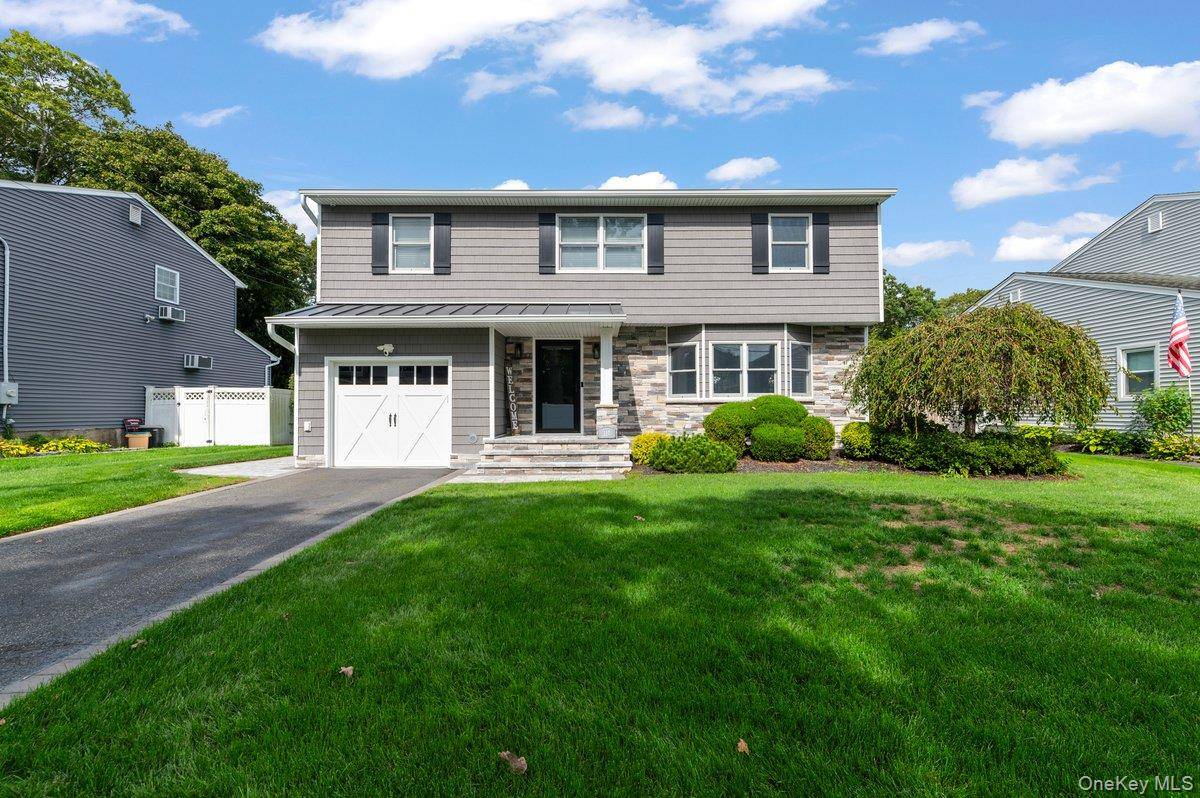 Welcome to this stunning four bedroom colonial, perfectly situated on a quiet dead end street in the sought after Sayville Connetquot Schools area.