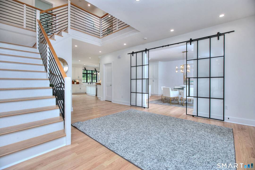 THIS NEW CONSTRUCTION CHECKS ALL THE BOXES OF A MODERN FARMHOUSE DESIGN.