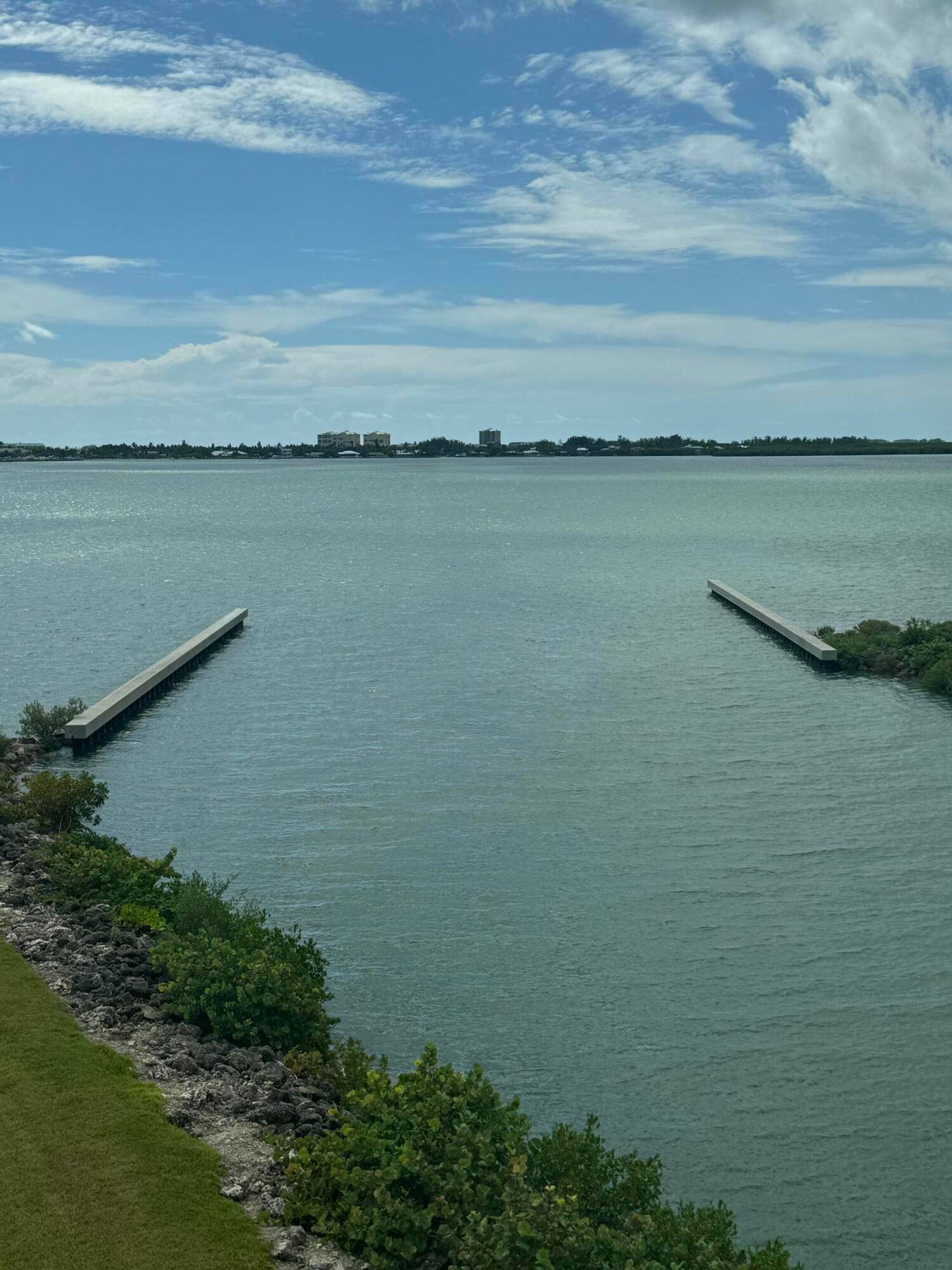 This beautiful end unit Penthouse offers a stunning view, perfect for those who love watching sailboats glide into the marina from the comfort of their Florida room.