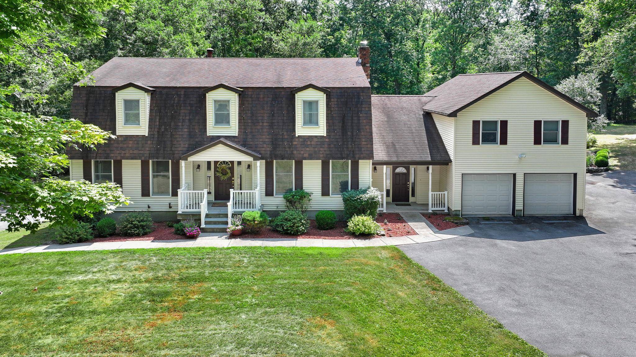 Nestled gracefully amidst more than thirteen acres of lush, undisturbed countryside, this remarkable colonial style residence stands as a testament to elegance, comfort, and thoughtful practicality.
