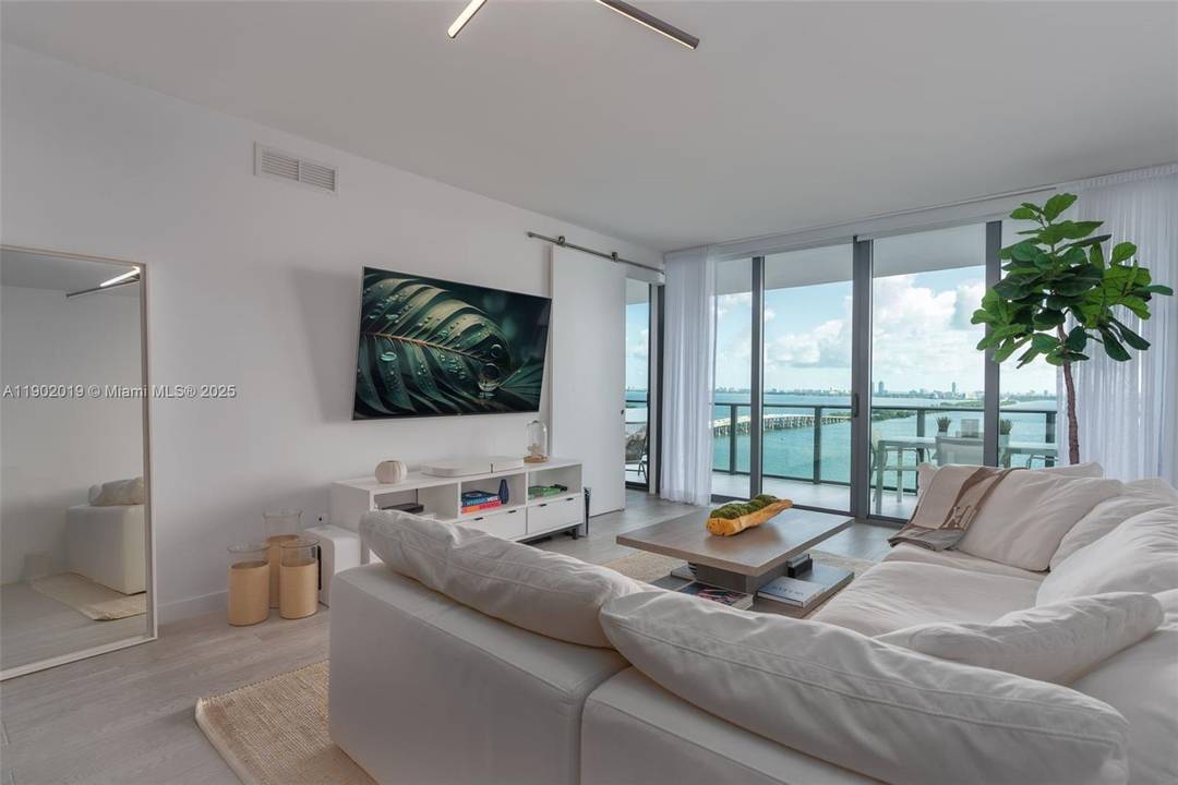 Enjoy breathtaking panoramic views of Biscayne Bay and Miami's skyline from this large luxurious unit in the iconic new waterfront development at One Paraiso Condo by renowned designer Piero Lissoni.
