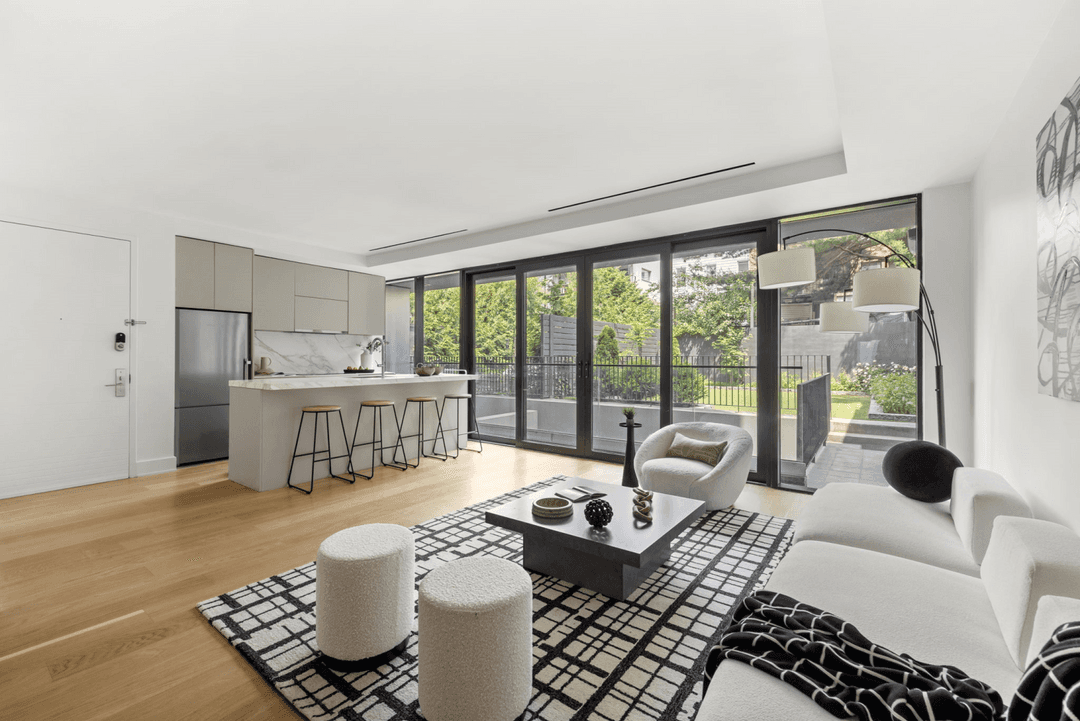 Welcome to 153 Green Street, Residence 1B, a stunning one bedroom, one and a half bath garden duplex that blends high design with exceptional functionality across two spacious levels, complete ...