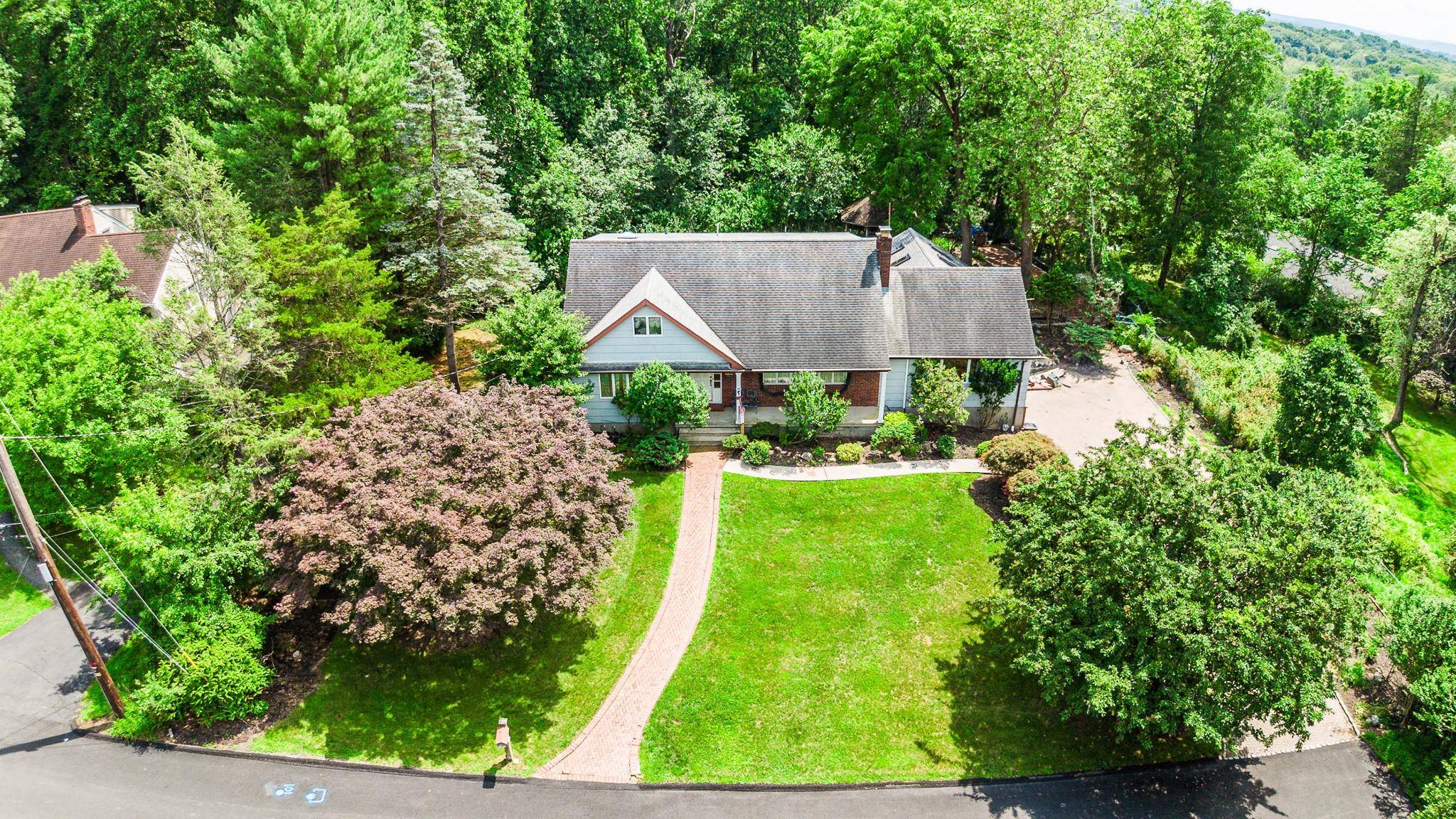 One of a kind Custom Cape Cod style home, expanded and updated, lovingly maintained and cared for the past 50 years by the same family.