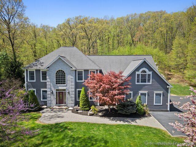 Experience refined living in this stunning colonial residence at 420 Winding Ridge Rd.