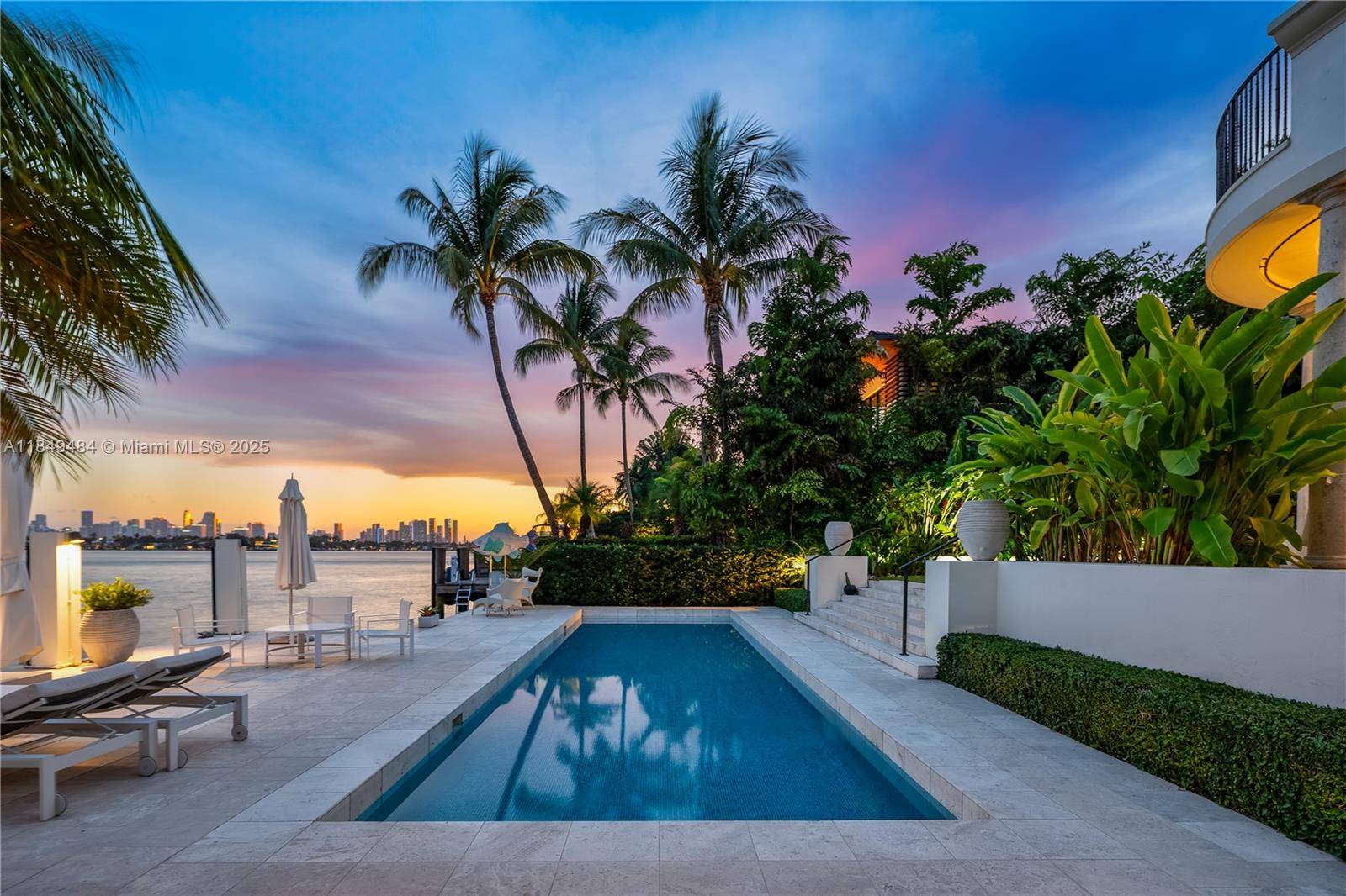 Located on the prestigious Sunset Island III, this exquisite 5 bed, 5.