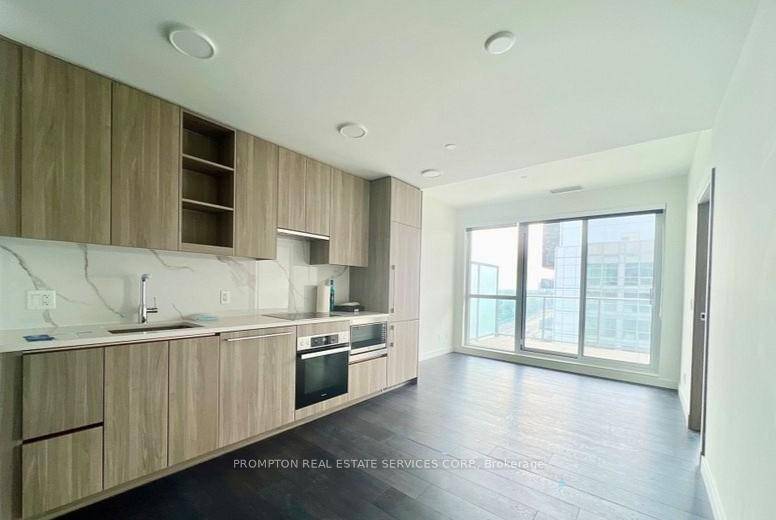 Experience refined living at the prestigious Saisons Condo in Concord Park Place, featuring a functional 1 Bedroom Den layout with an expansive 163 sq.