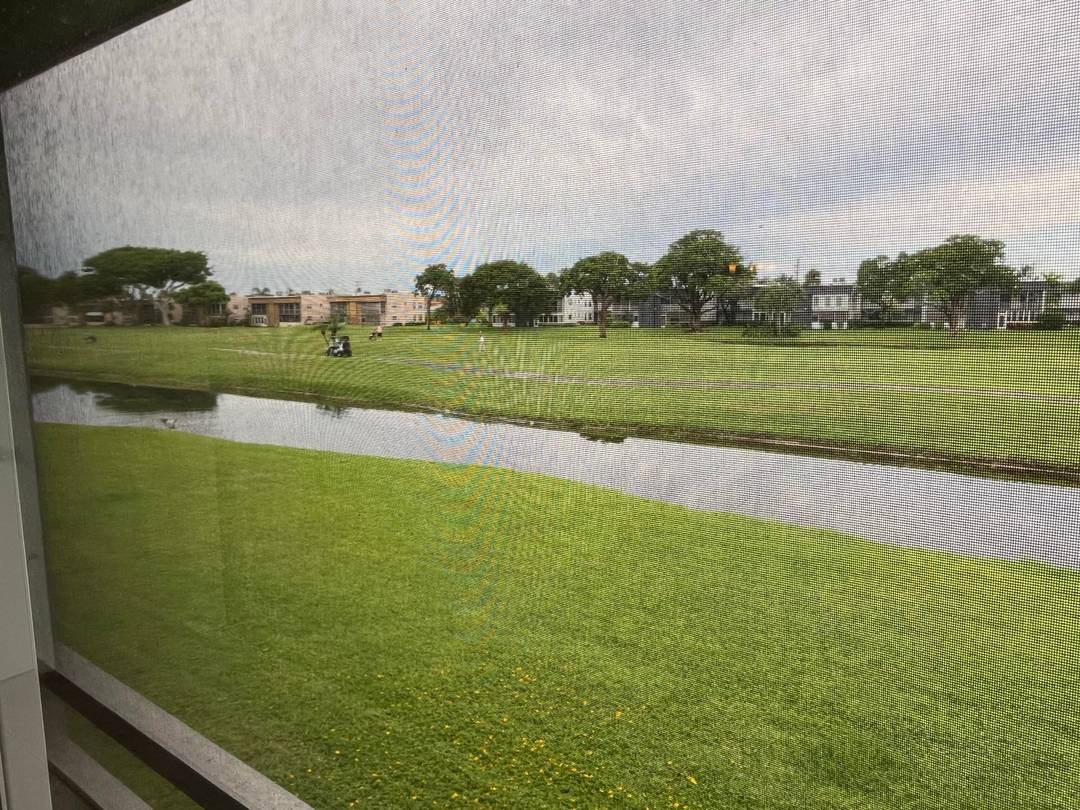 Afternoon setting sun from your huge wide enclosed patio overlooking the peaceful serene lake and golf course views.