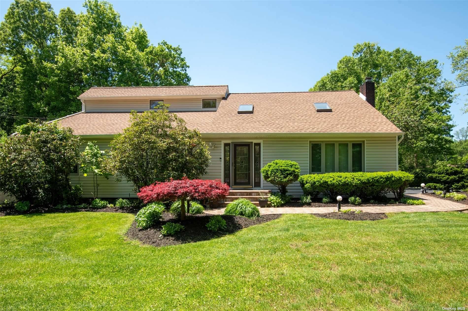 Welcome to this updated contemporary home in the heart of Smithtown.