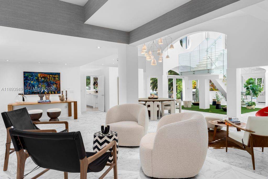 Discover contemporary elegance in this stunning 5, 681 SF waterfront residence on the coveted Coral Gables Waterway.