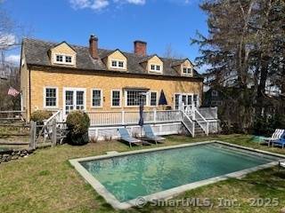 Restored country cottage furnished with antiques, fine furnishings oriental rugs.