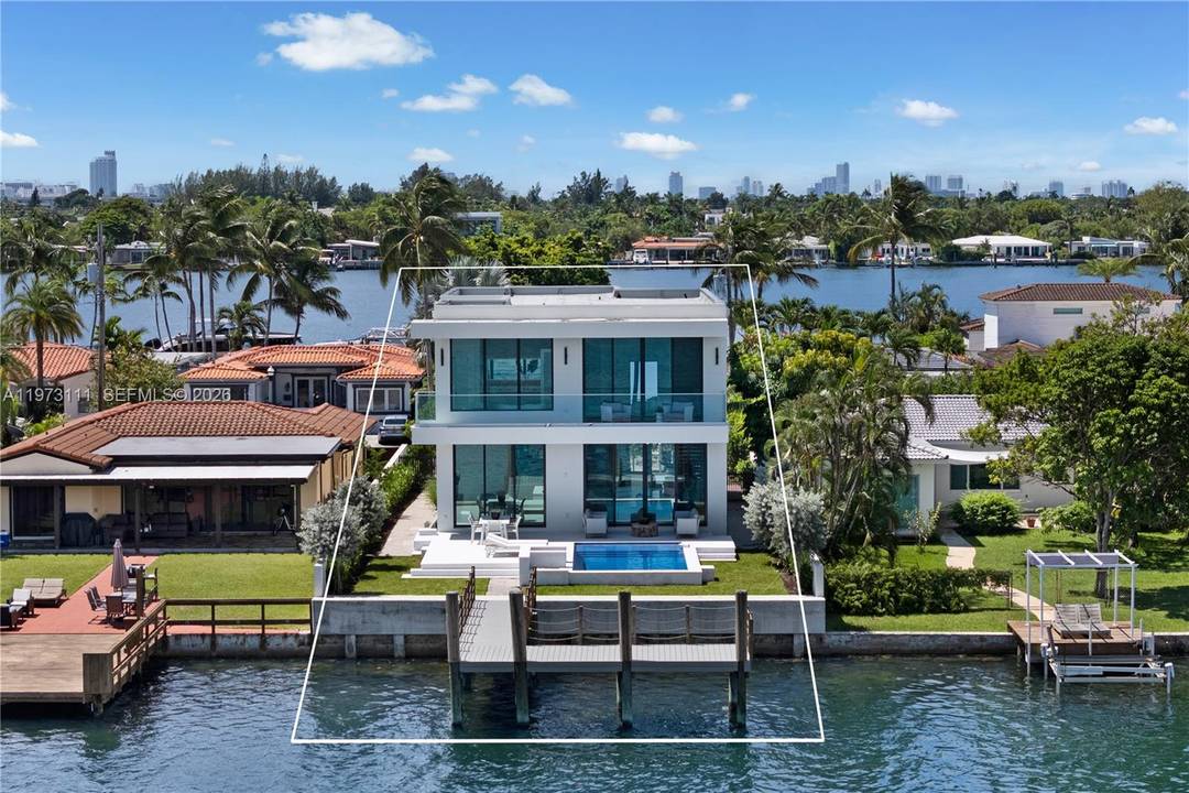 Exceptional new construction waterfront residence in a prestigious gated community with ocean access and bay views.