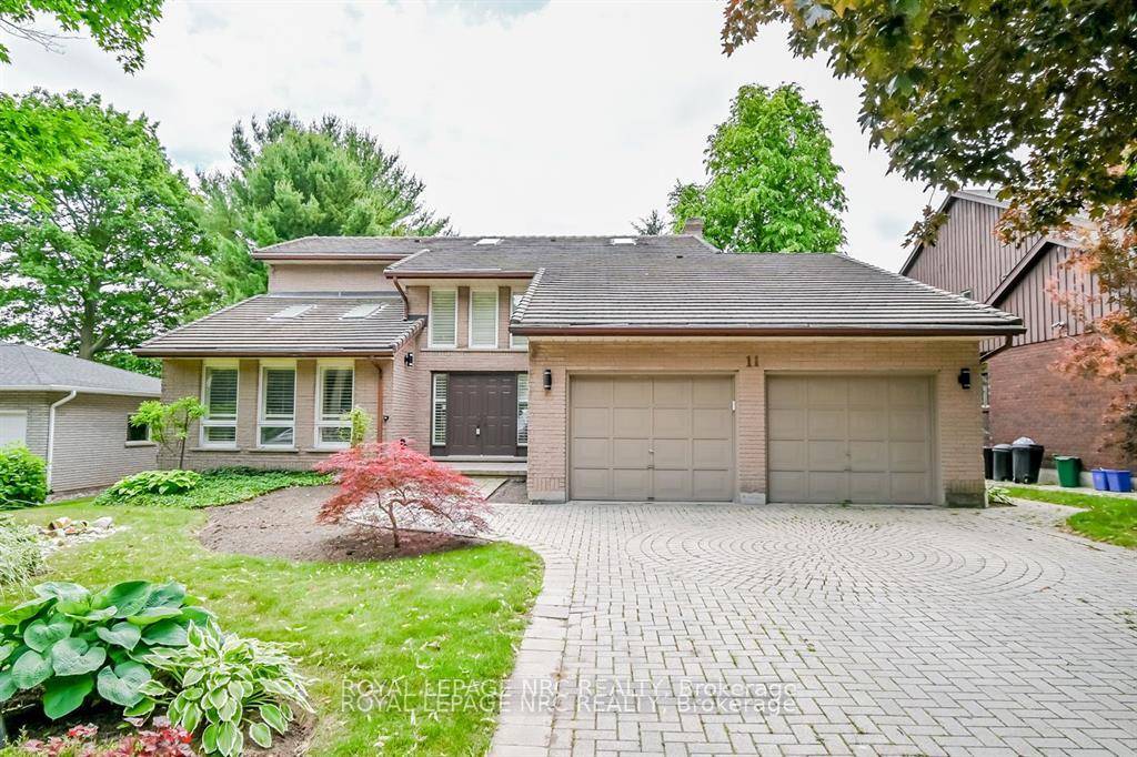 Custom built executive 2 story solid brick home with ground level walkout basement An abundance of natural light and warmth from the oversized windows and skylights.