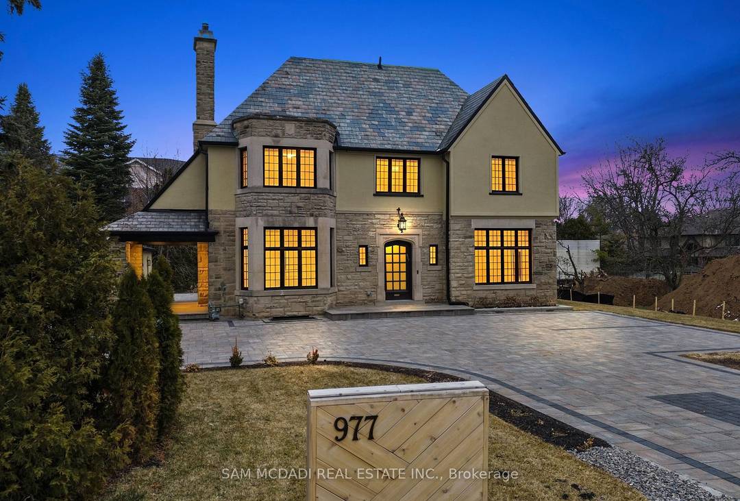 Welcome to the famous George Unsworth home, a high quality Neo Tudor style home constructed with cut amp ; carved stone alongside a textured stucco exterior finish.