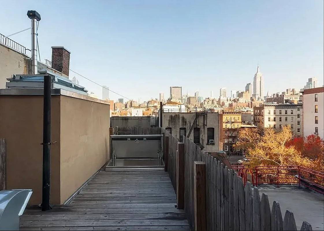 Beautiful three bedroom apartment with balcony, private roof deck, marble bathroom, washer amp ; dryer, and granite kitchen with stainless steel appliances, wine cooler, and dishwasher.