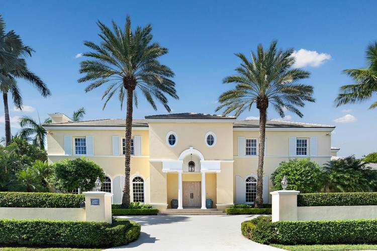 This British Colonial residence offers 6, 922 total square feet with five bedrooms and six and a half bathrooms.
