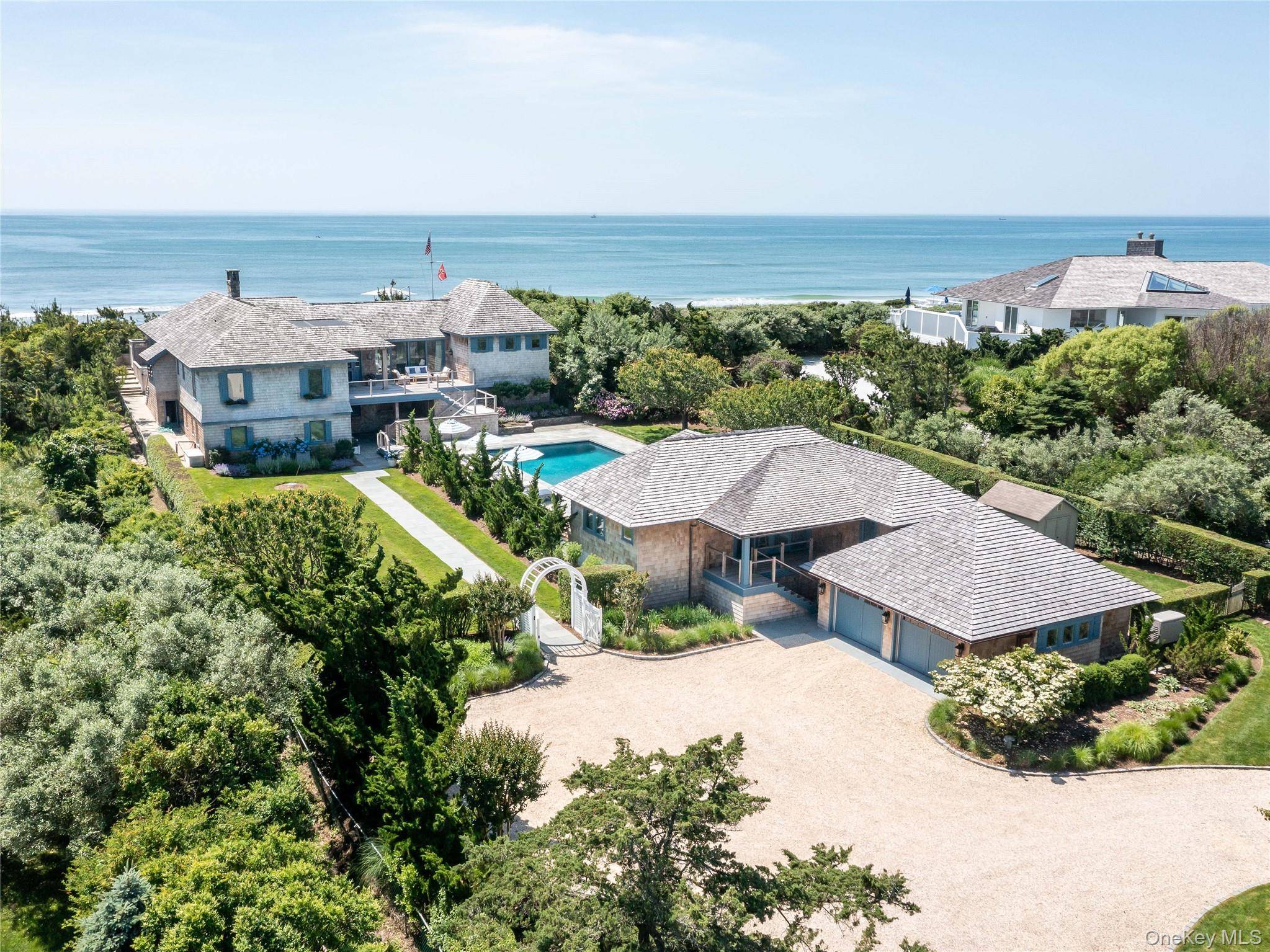 Set along the coveted shores of Dune Road in Quogue, this extraordinary oceanfront estate spans 1.
