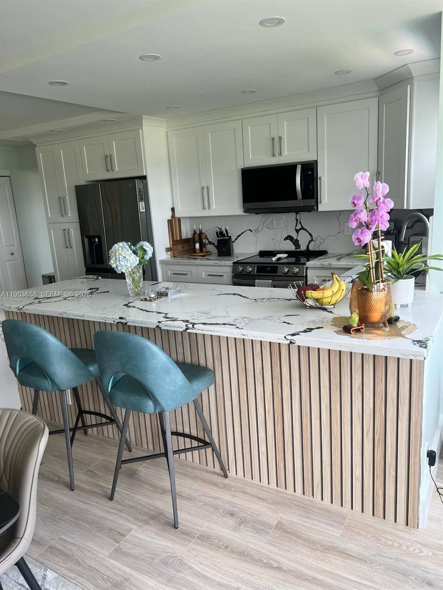 Beautifully renovated 2 2 condo with stunning views of the Coral Ridge Country Club golf course located one mile from Lauderdale by the Sea beach.