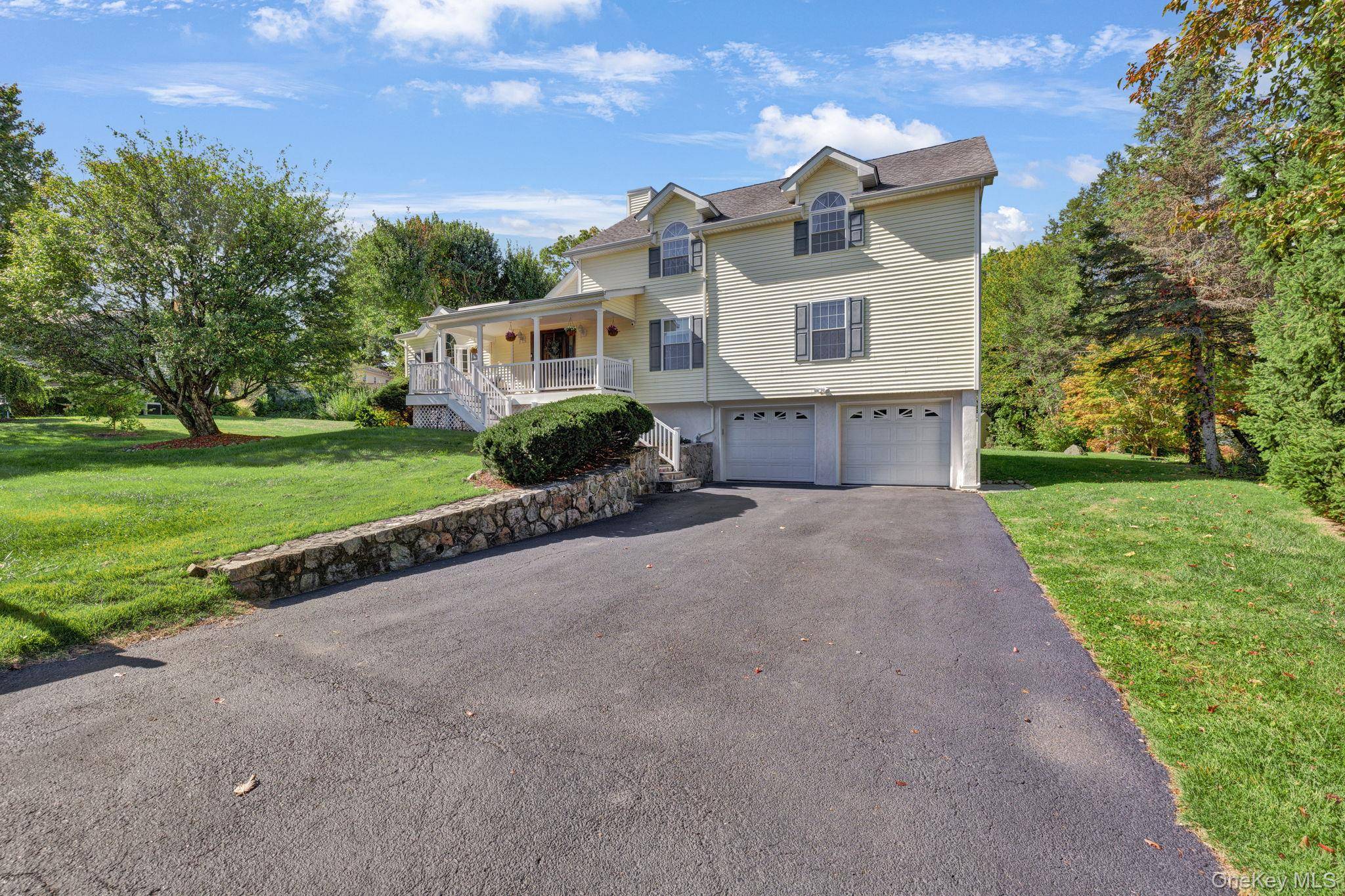 Unassuming from the curb, this expanded ranch style home offers far more than meets the eye.