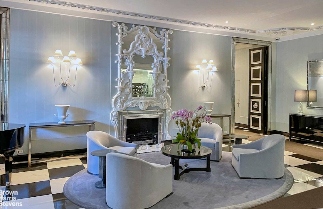 Enjoy loft like living in this unique Central Park South one bedroom residence with new kitchen, elegant entry foyer and a home office.