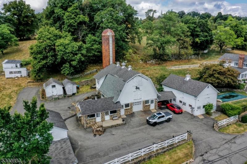 Welcome to this 95 acre farmland currently used as a horse farm with 31 stalls, barn, tack room, hay storage shed, indoor outdoor riding arena and miles of riding trails.