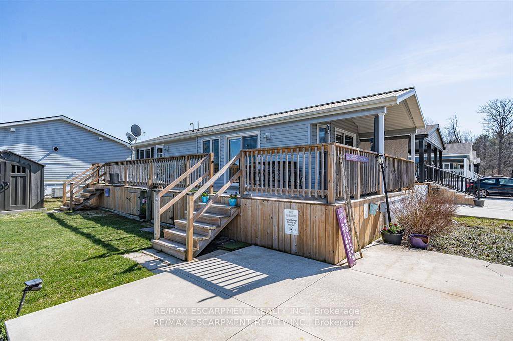 Welcome to this meticulously maintained custom modular home nestled within the sought after Lost Forest Park Gated Community.