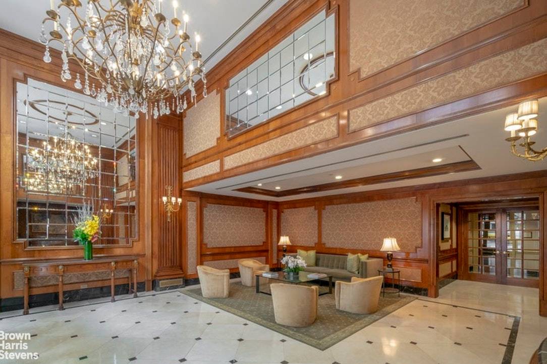 A gracious and welcoming large entrance foyer with 9 feet ceilings and classic moldings that grace the whole apartment, opens to a spacious living room, dining room, and a wide, ...