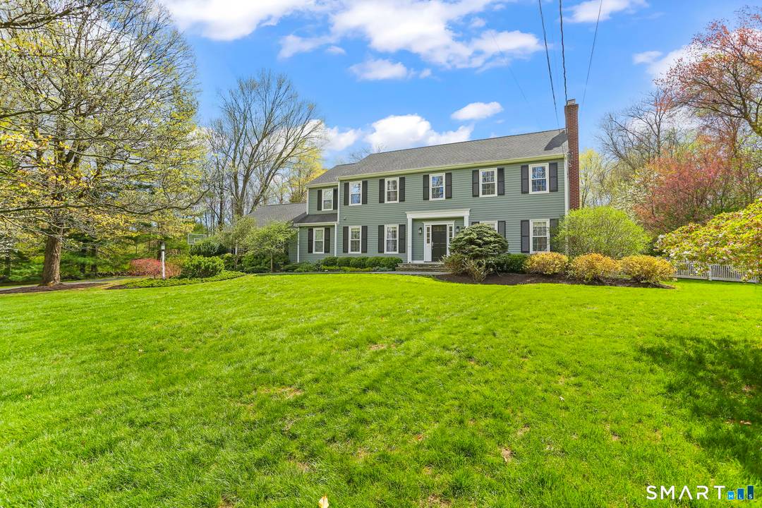 Welcome to 621 Shrub Oak Lane, a classic Colonial set on two private acres in Greenfield Hill.